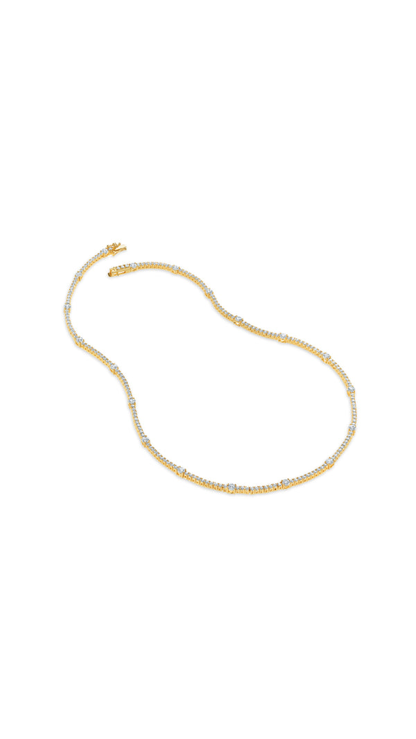Phoebe refined take on the classic gold tennis style necklace, featuring brilliant stones punctuated with larger round keystones - CARAT* LONDON