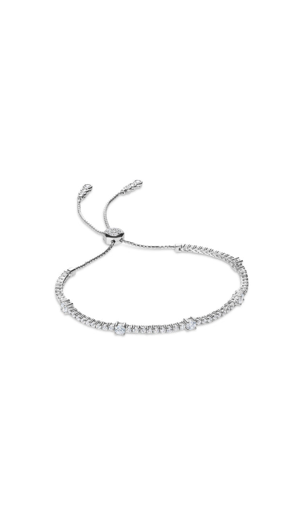 Stylish women's tennis bracelet in silver with an adjustable closure and timeless diamond-style setting on white background.