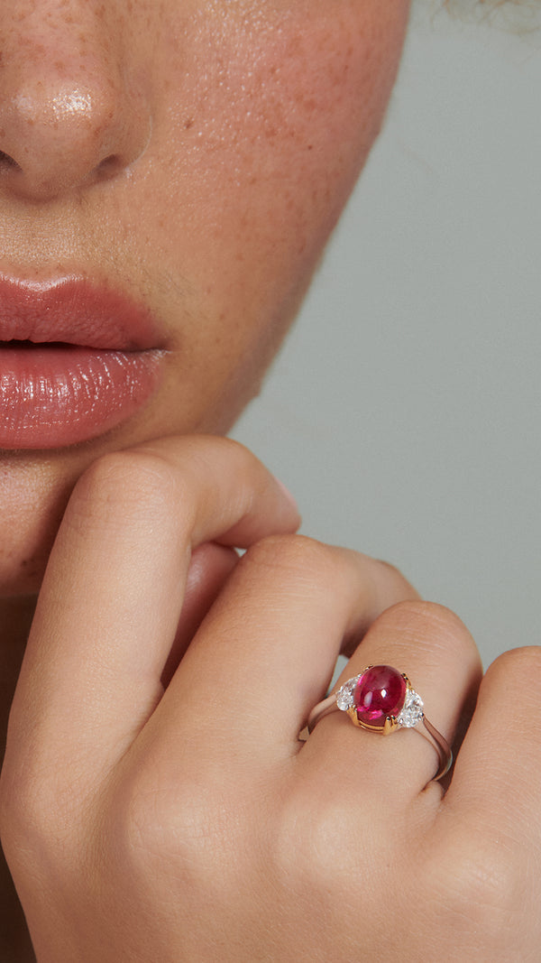 Solitaire ring with lab-grown ruby and diamonds.