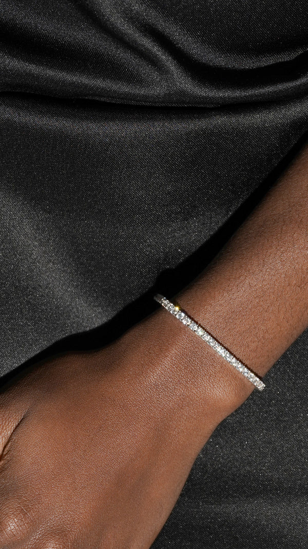 Dainty tennis bracelet set in white gold for a bold yet classic look.