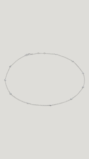 Petra 18k solid white gold station necklace for women.