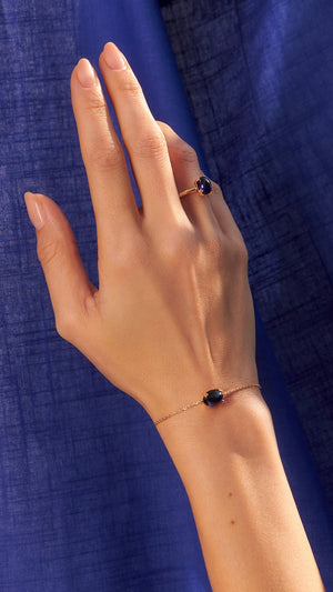 Gold vermeil slider bracelet and ring for women with recycled sapphire cabochon stone from the sugardrop collection