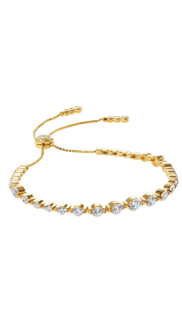 Gold tennis bracelet for women featuring varying sizes of Round Brilliant cut stones, Grace is a modern take on the traditional tennis bracelet.