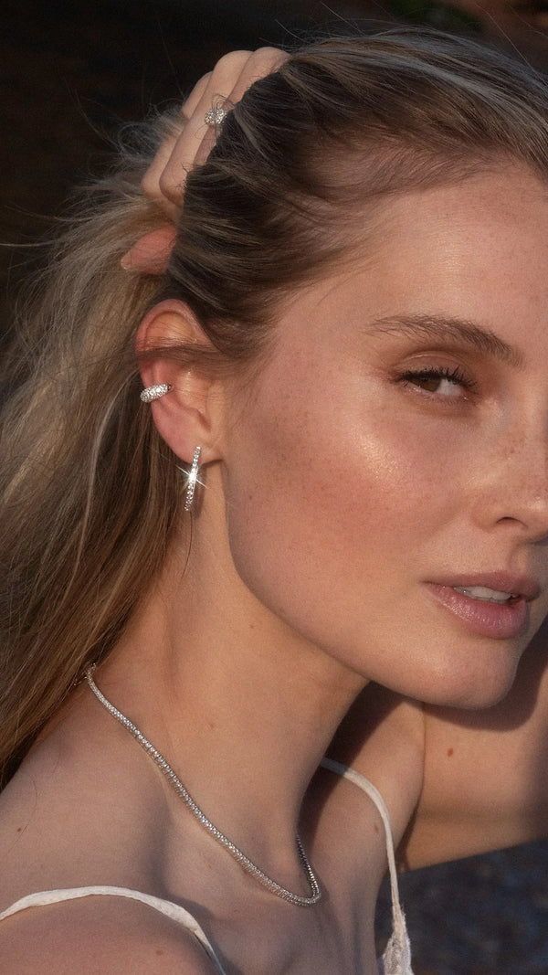 Sterling silver simple ear cuff earring paired with sterling silver hoops for everyday wear