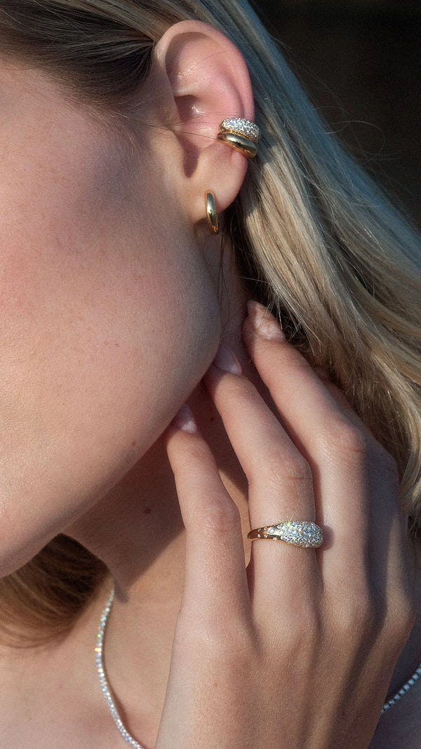 Gold Hera statement ring stacked with gold ear cuffs uk