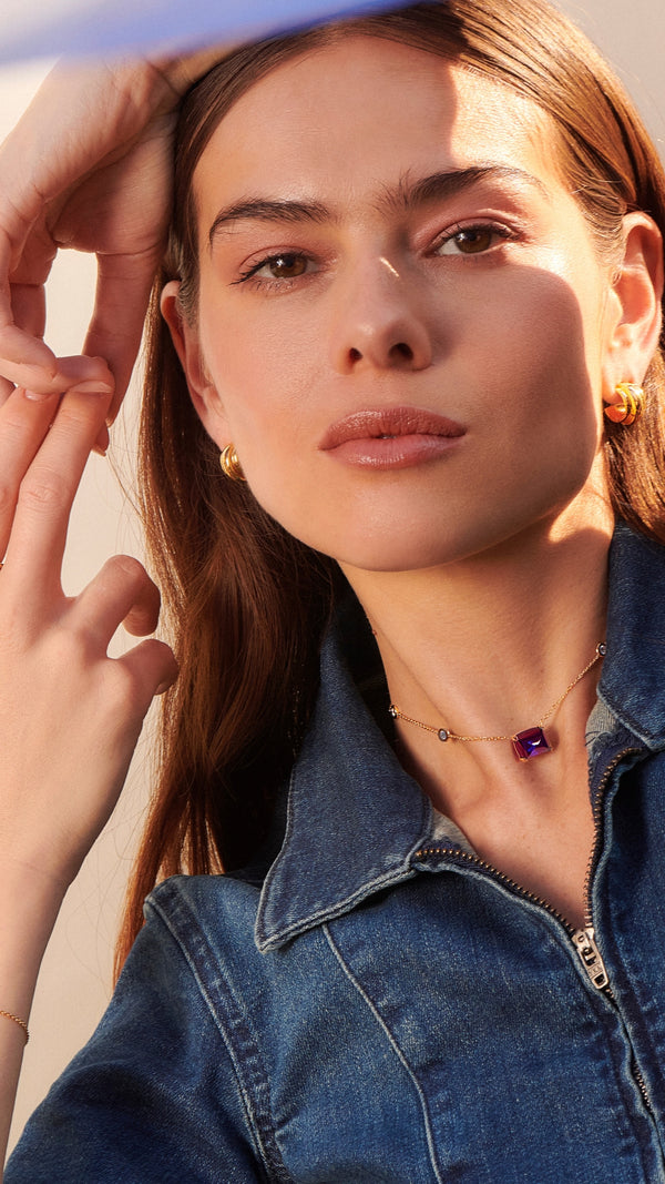 Lab-grown recycled tanzanite stone on a gold station necklace for women from the sugardrop collection