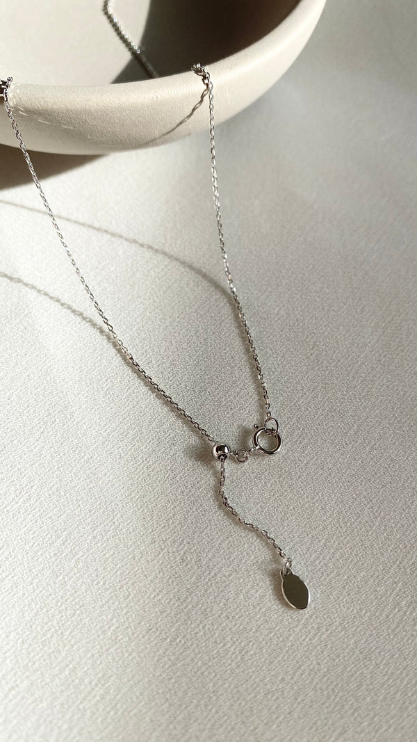 18k solid white gold solitaire necklace with a lab grown diamond pendant.