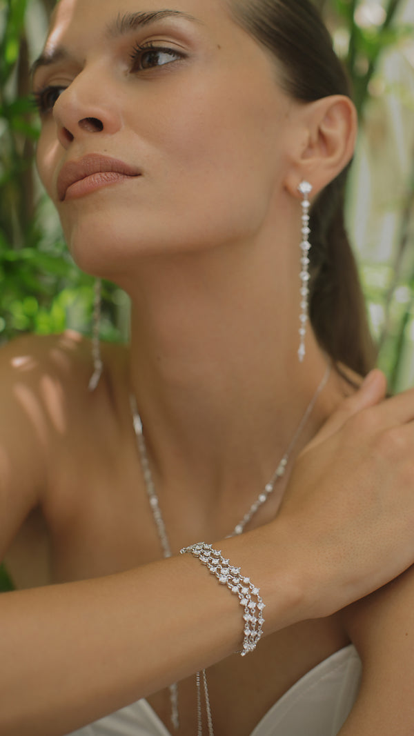 Sophisticated carat bracelet styled with matching Phoenix collection earrings