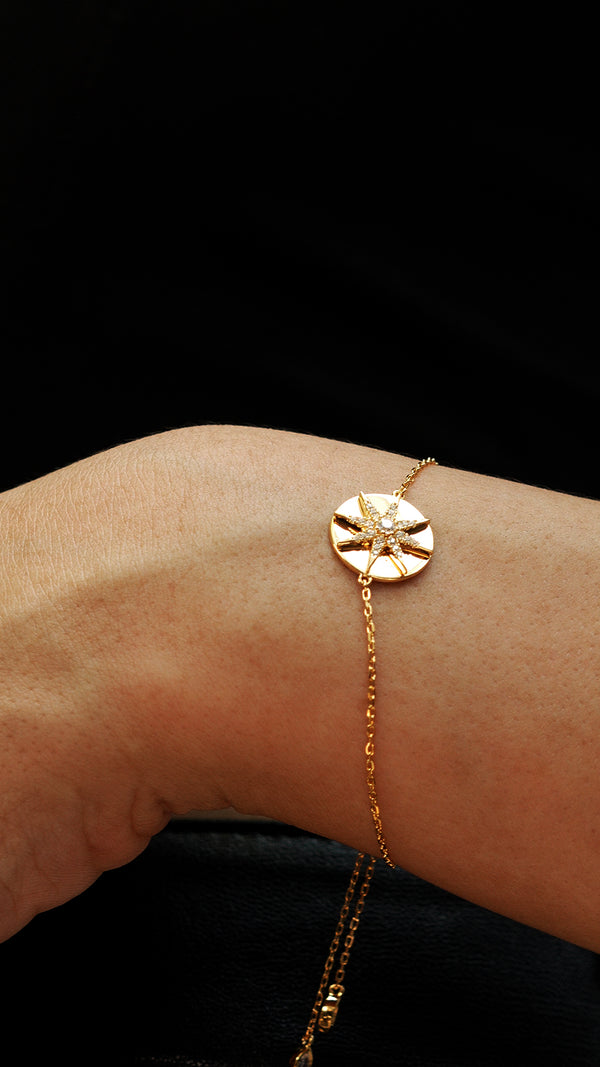 Elegant gold bracelet for women featuring a delicate star design