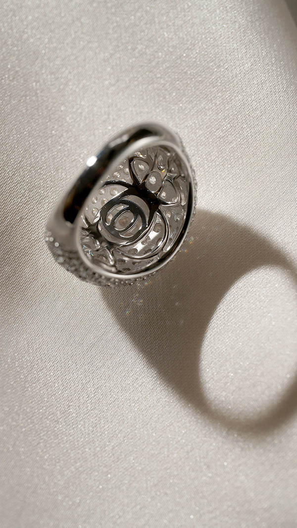 "Close-up of the elegant under-gallery of the Reese pave dome ring, crafted in sterling silver with a white gold finish, showcasing intricate metalwork and refined craftsmanship.