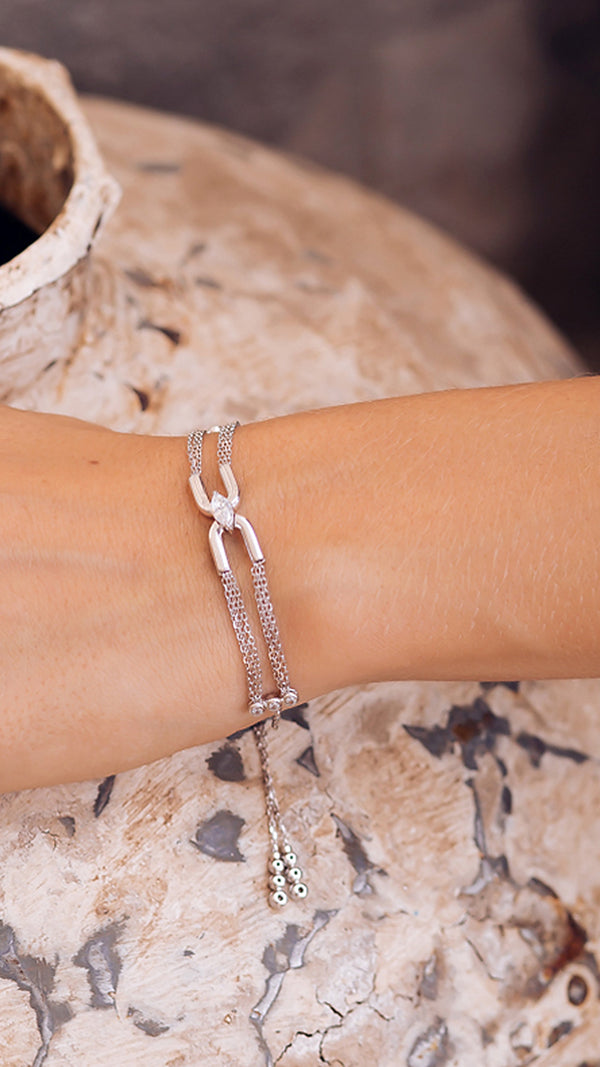 Sterling silver adjustable chain bracelet with white gold plating and a marquise gemstone.