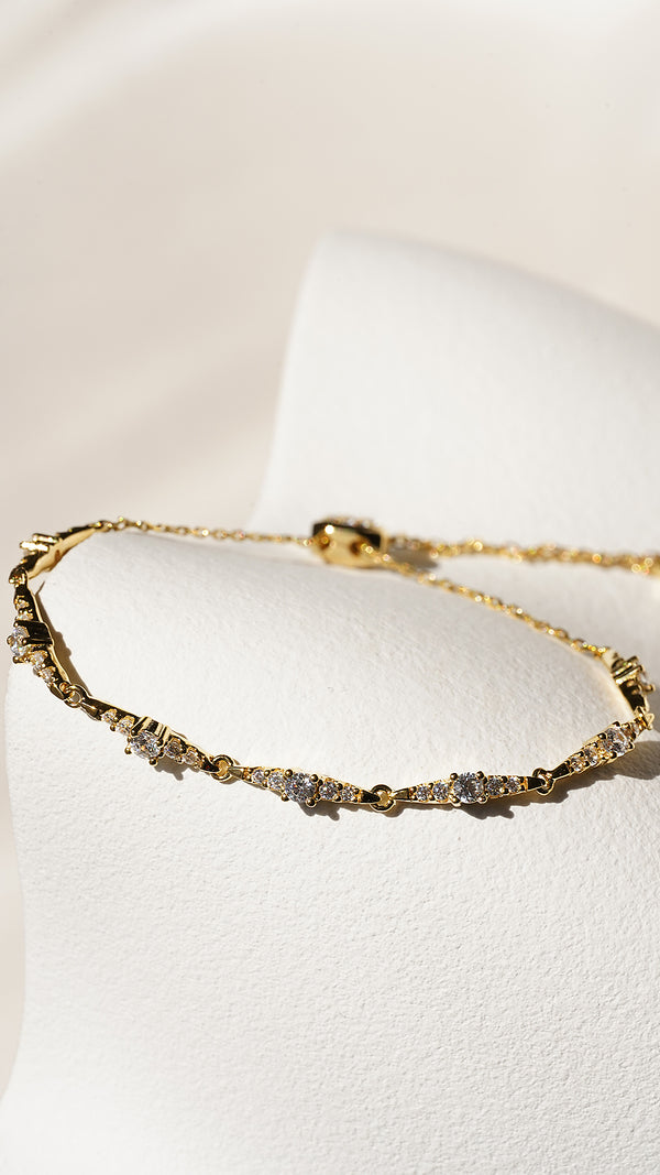 Gold slider bracelet with star design