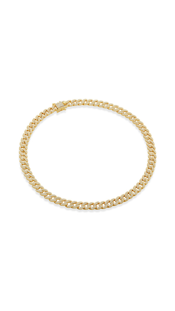 Large gold cuban chain necklace made from sterling silver with gold vermeil against a white background.