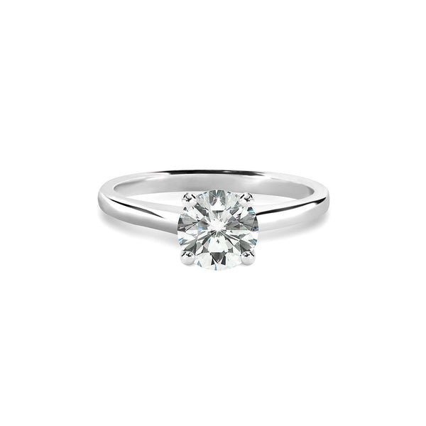 The Caroline Ring features a lab grown diamond in a classic round cut, set in polished 18K white gold—perfect for engagement rings or carat rings.