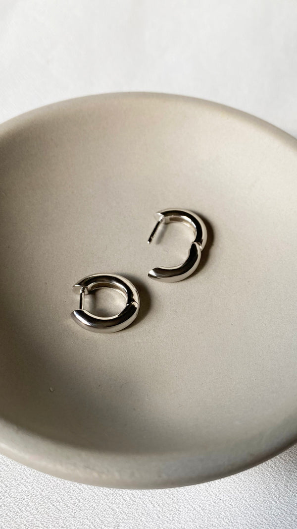 Classic high-polish sterling silver hoops, perfect for wearing solo or stacking with other earrings.