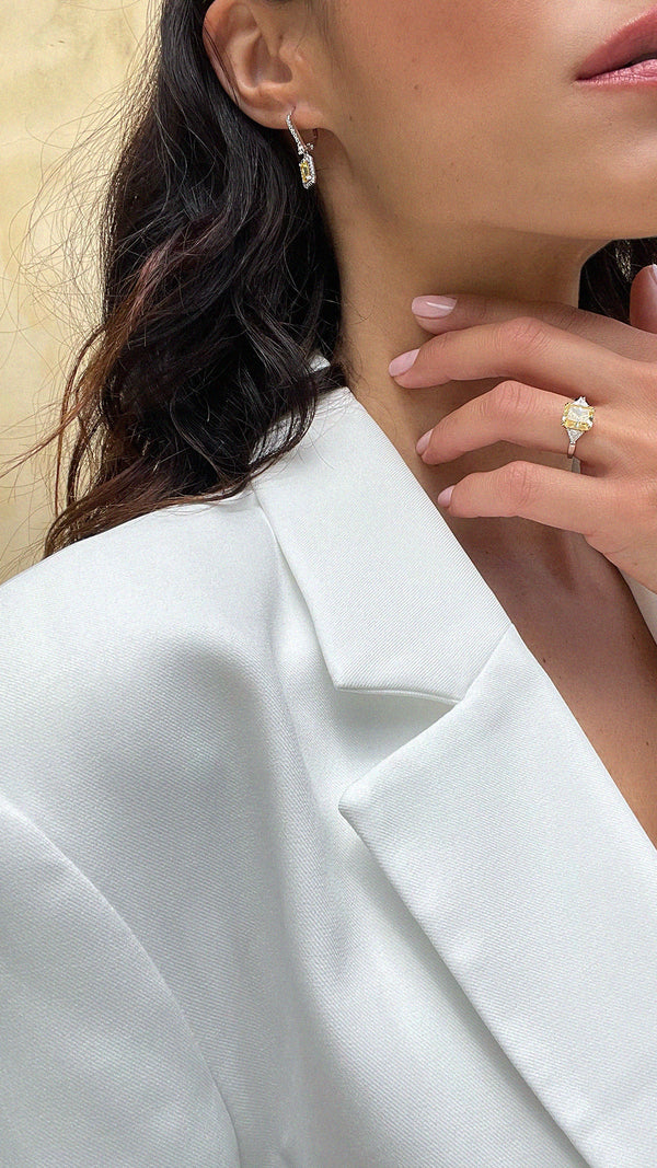 Woman wearing the light yellow Alma baby cocktail ring for a casual daily look.