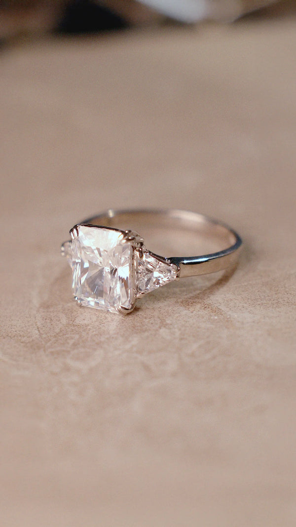 Radiant cut diamond style trilogy ring for women.