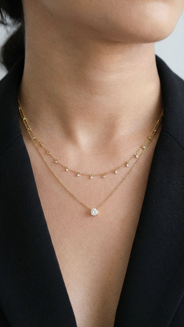 vAa adjustable slider necklace in yellow gold vermeil featuring a double row of bezel-set stones and a round brilliant solitaire pendant.