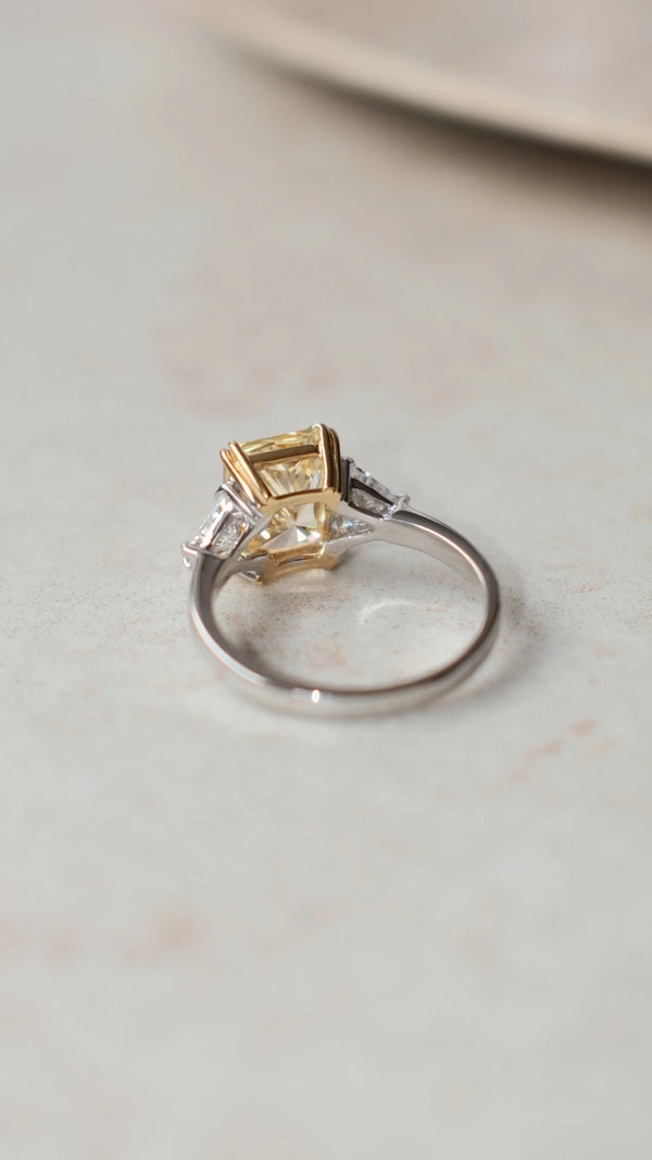 3ct light yellow radiant cut ring in sterling silver with triangle-cut shoulder stones
