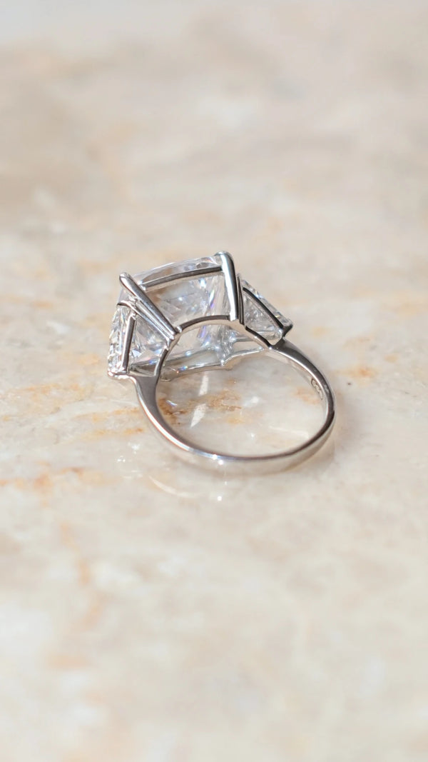 Back view of the Gemma trilogy ring's cushion cut facets and silver setting.