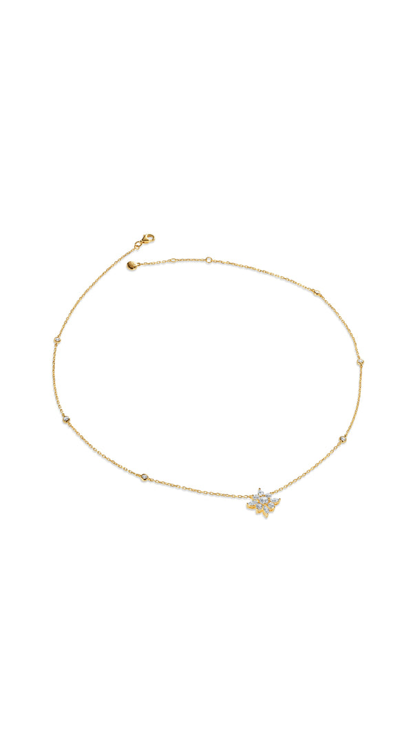 Delicate gold chain embellished necklace with round cut stones in bezel setting. Features a cluster of Round and Marquise cut stones resembling a flower.