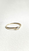 Minimalist solid gold ring with lab grown marquise diamond.