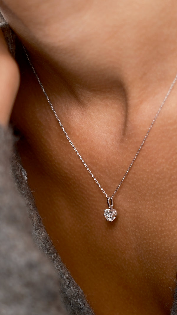 Elle, classic 18k white gold solitaire necklace featuring a round lab grown diamond pendant. 