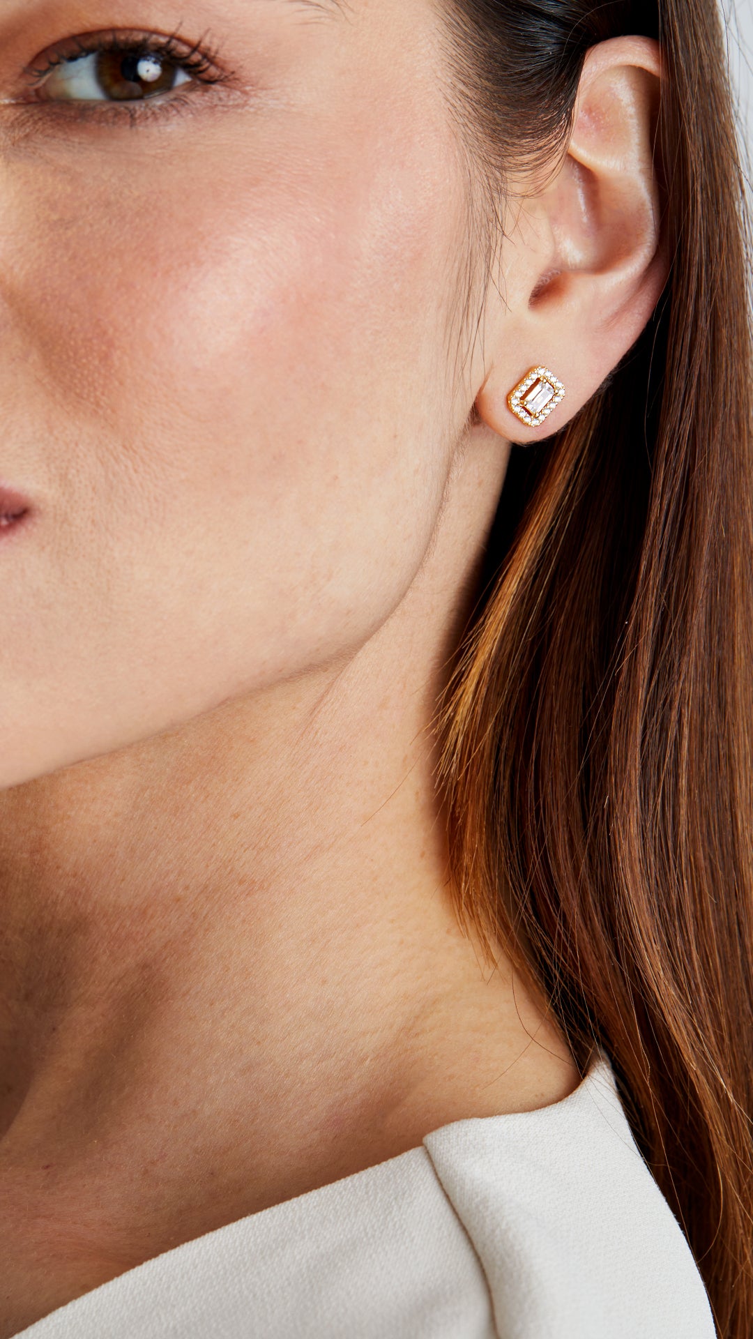 Small emerald cut stud earrings, border setting. Timeless jewellery for women.