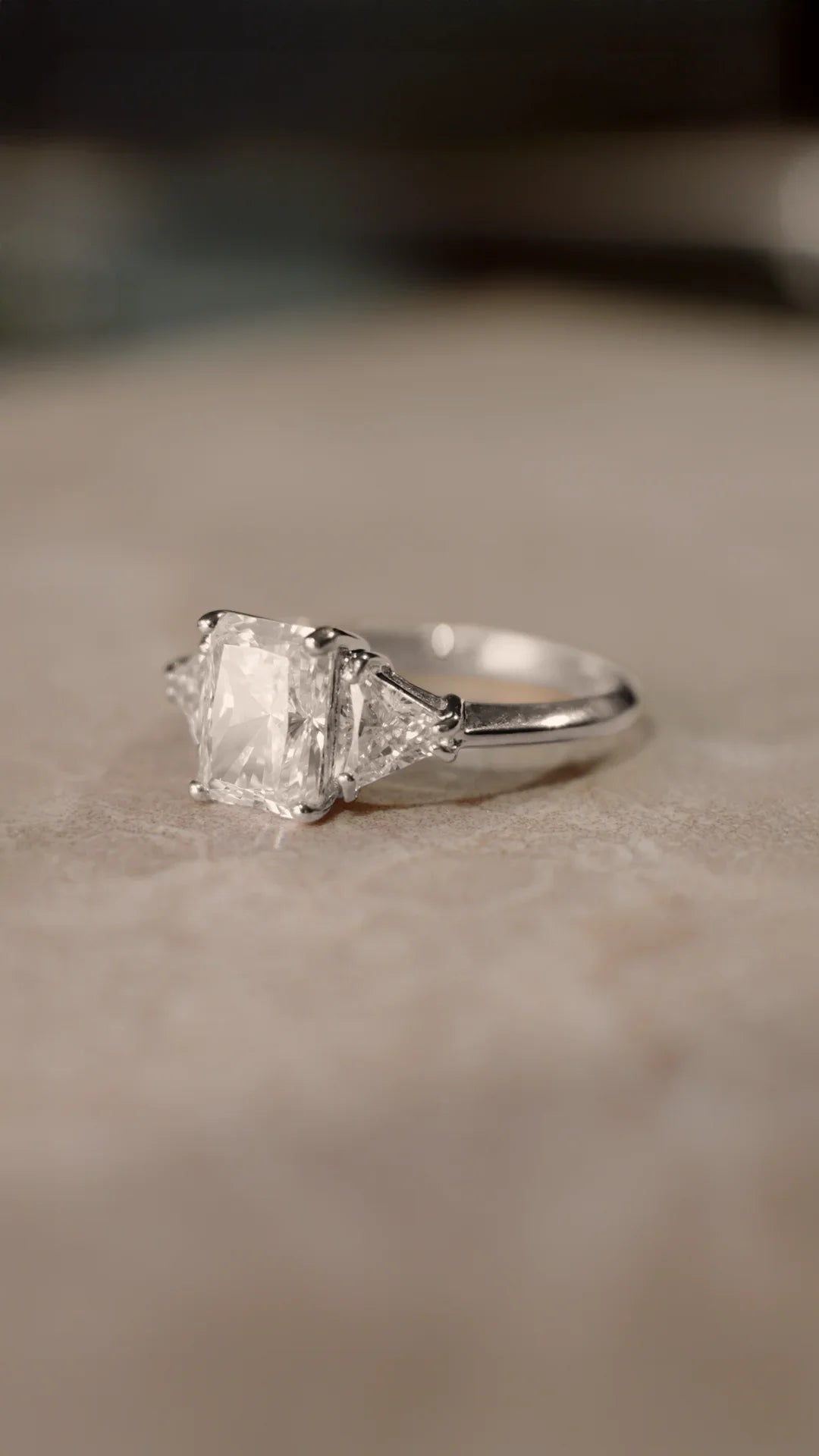 Sterling silver radiant cut trilogy ring for women.
