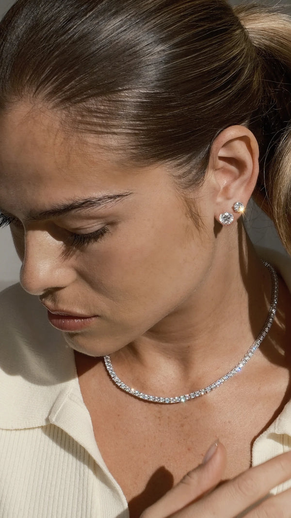Brilliant cut solitaire stud earring in a 9K white gold setting in 1ct and 2ct with tennis necklace. 