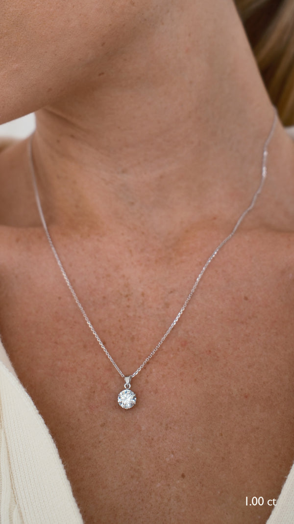 9k solid gold solitaire pendant necklace with a 1ct stone.