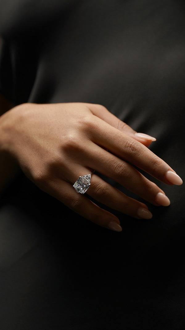 Three-stone sterling silver ring with a classic cushion-shaped center stone.
