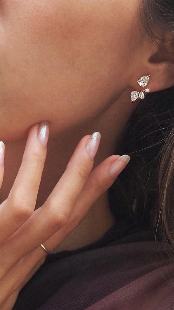 Modern bridal ear jackets with white pear-cut stones in 18k gold vermeil.