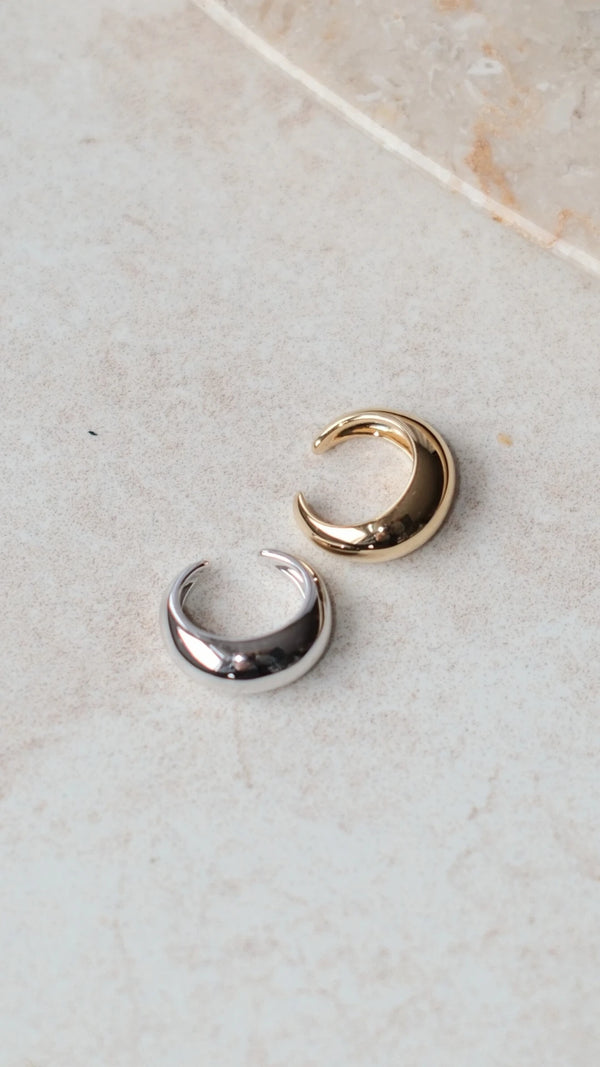 Side-by-side comparison of a sterling silver and yellow gold vermeil ear cuff.