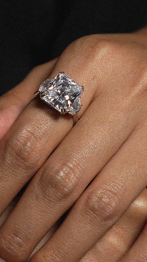 7ct eq radiant cut cocktail ring in sterling silver with half-moon side stones.