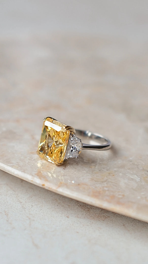 Luxury sterling silver statement ring with a vibrant yellow center stone