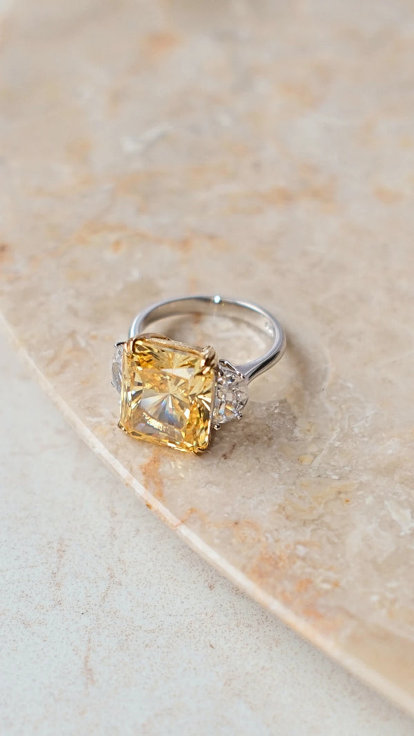 High-shine sterling silver jewelry featuring a large canary yellow radiant cut