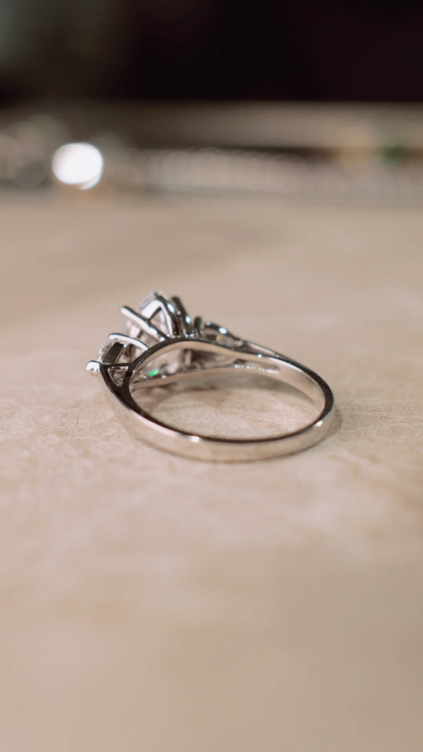 9K solid white gold ring with pear cut centre stone.
