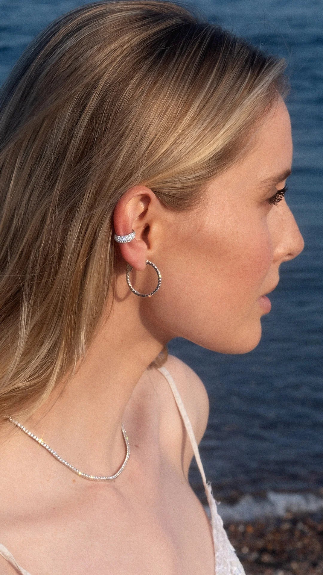 Sterling silver ear cuff paired with silver hoop earring for women