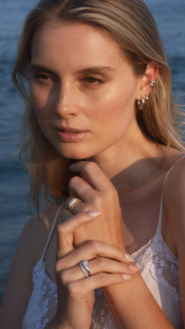 Stacking statement rings in sterling silver and gold vermeil paired with eternity rings for women