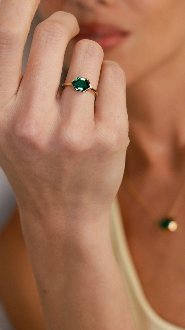 18K gold vermeil geometric ring with a six-sided green stone.
