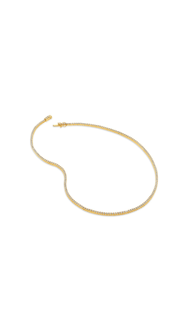 Lexi gold vermeil skinny tennis necklace on a white background - CARAT* LONDON