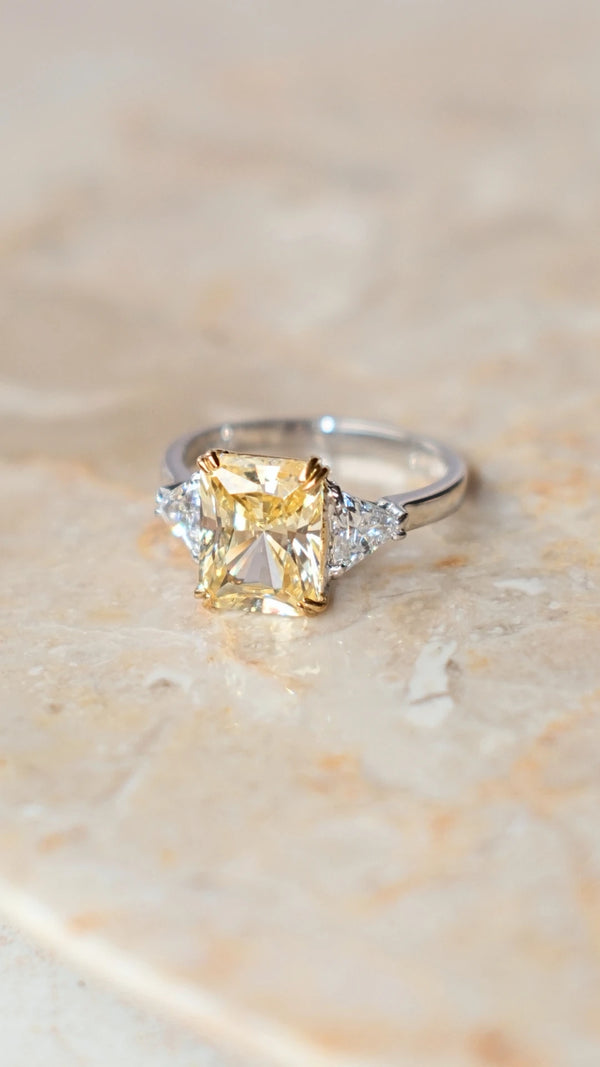 Three-stone sterling silver cocktail ring with 70-facet radiant cut centre stone.