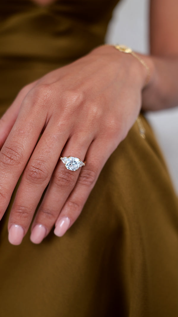 3ct eq. Flanders cut trilogy ring in yellow gold vermeil with double prong setting.