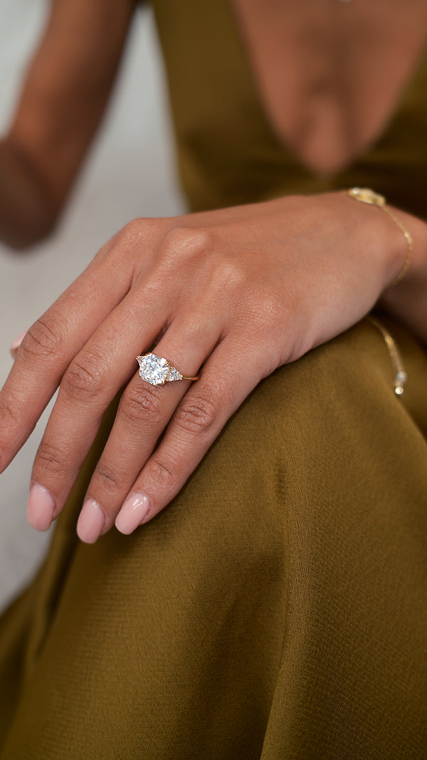 Gold vermeil trilogy ring with a square-shaped Flanders cut and side stones.