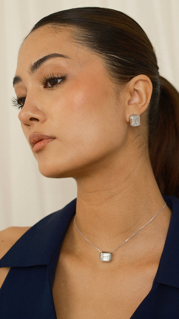 Modern emerald-cut earrings and matching necklace set in sterling silver. 