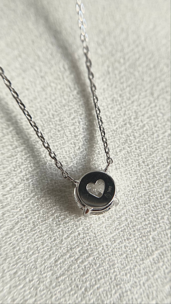 Lab grown diamond necklace with heart design laser cut casing.