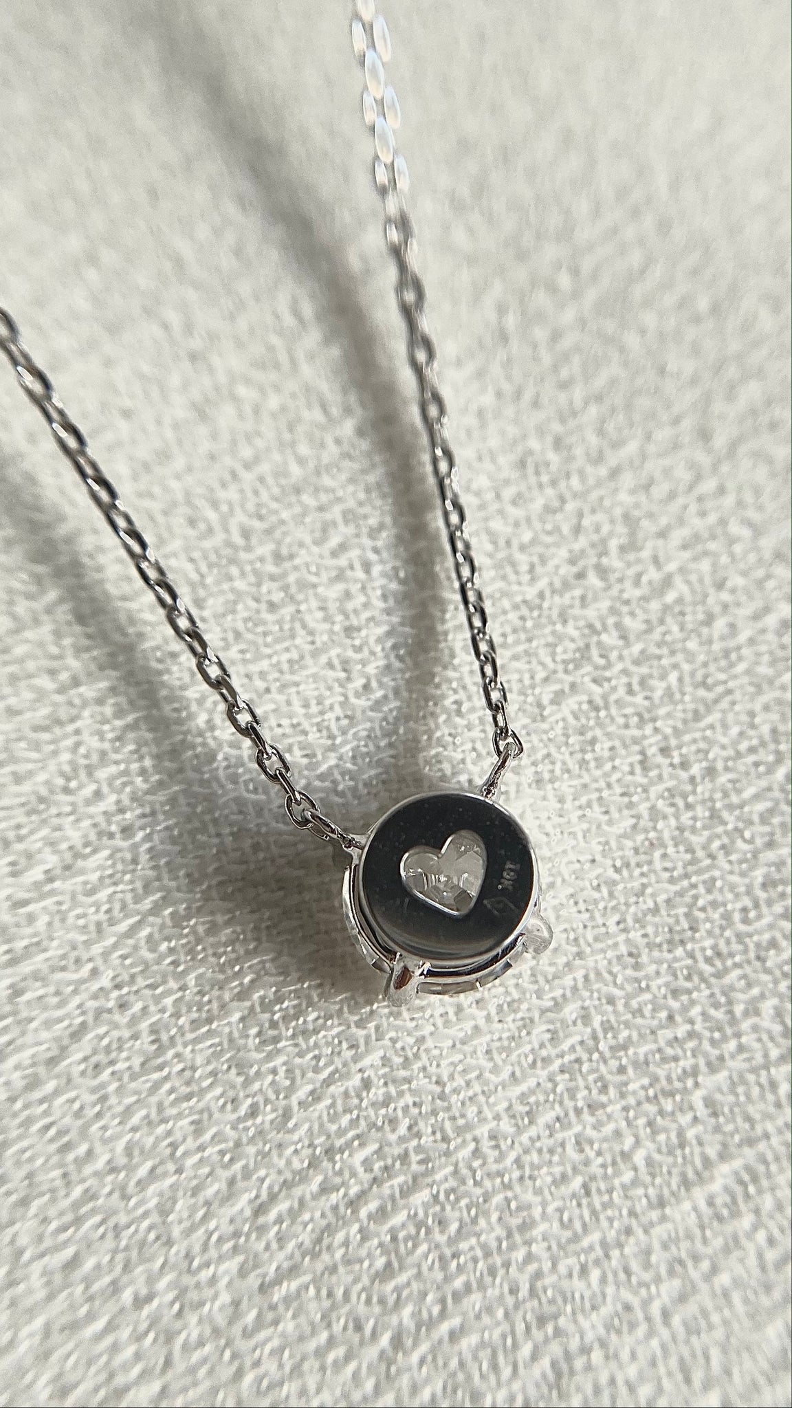 Lab grown diamond necklace with heart design laser cut casing.