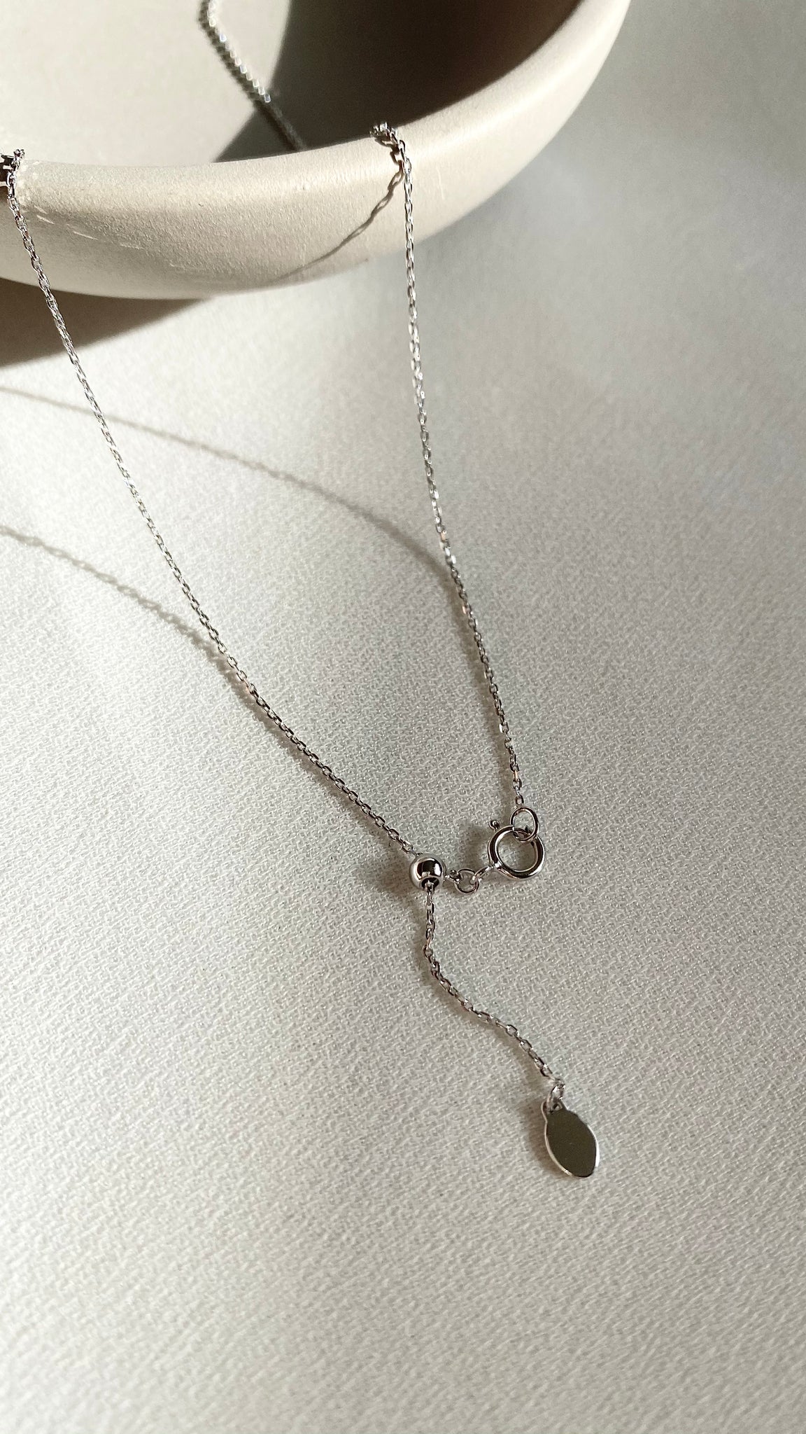 18k solid white gold solitaire necklace with a lab grown diamond pendant.