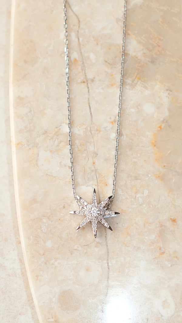 45cm sterling silver star necklace with an adjustable rolo chain length.
